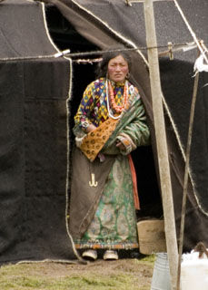 Tibetan nomad woman in front of black tent